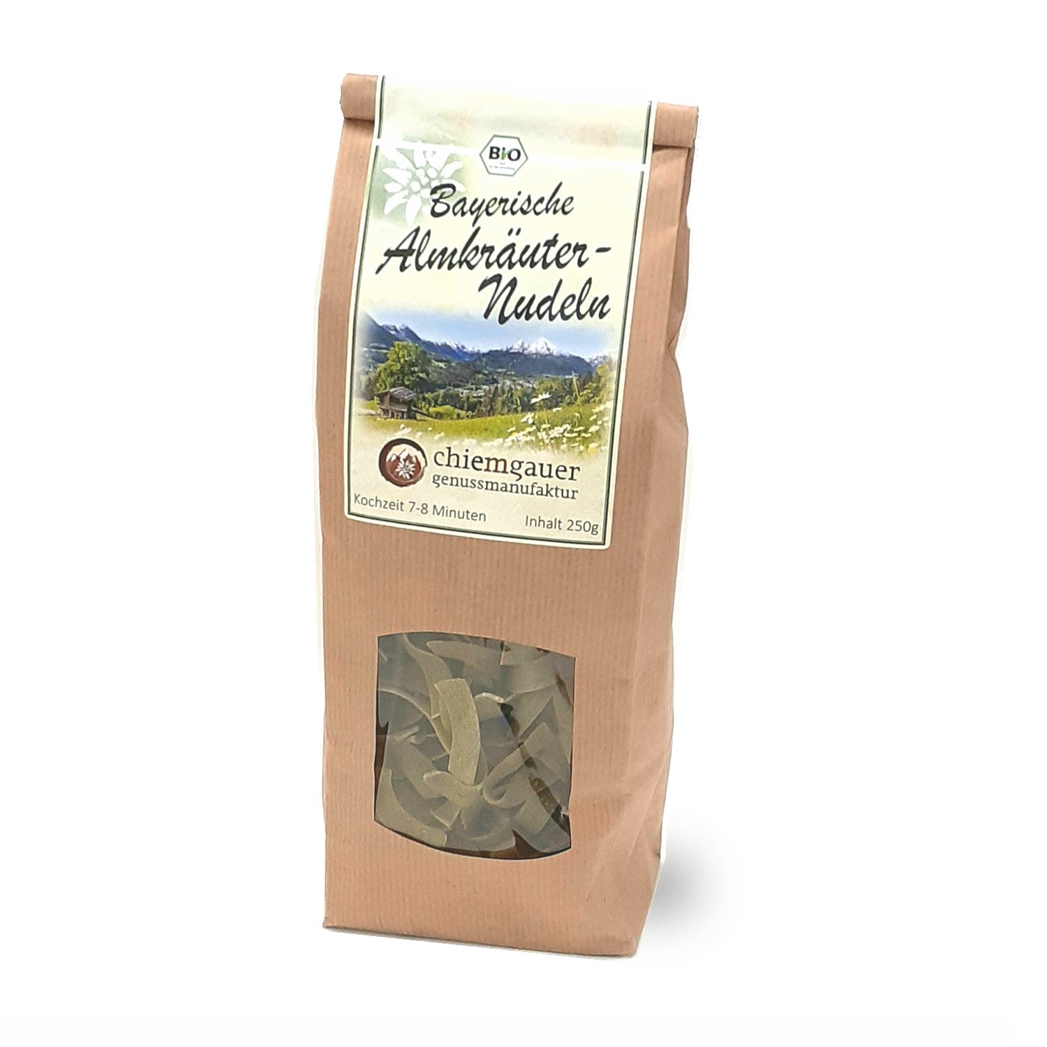 Braune Packung Bio Bayrische Almkräuternudeln mit Sichtfenster und Alpenlandschafts-Label, 250g.