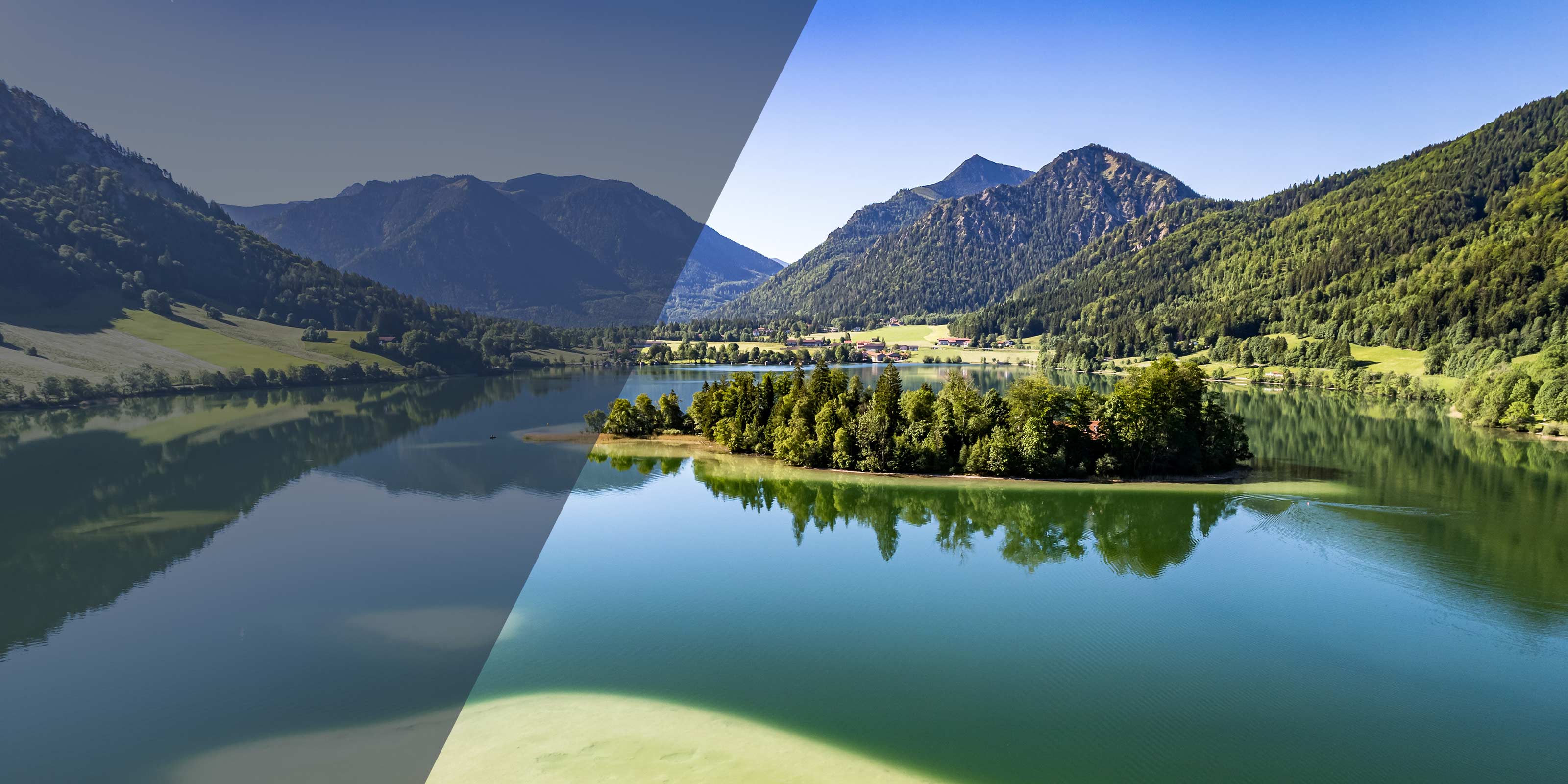 Idyllischer Alpensee Spitzingsee mit bewaldeter Insel und bergiger Landschaft unter klarem Himmel