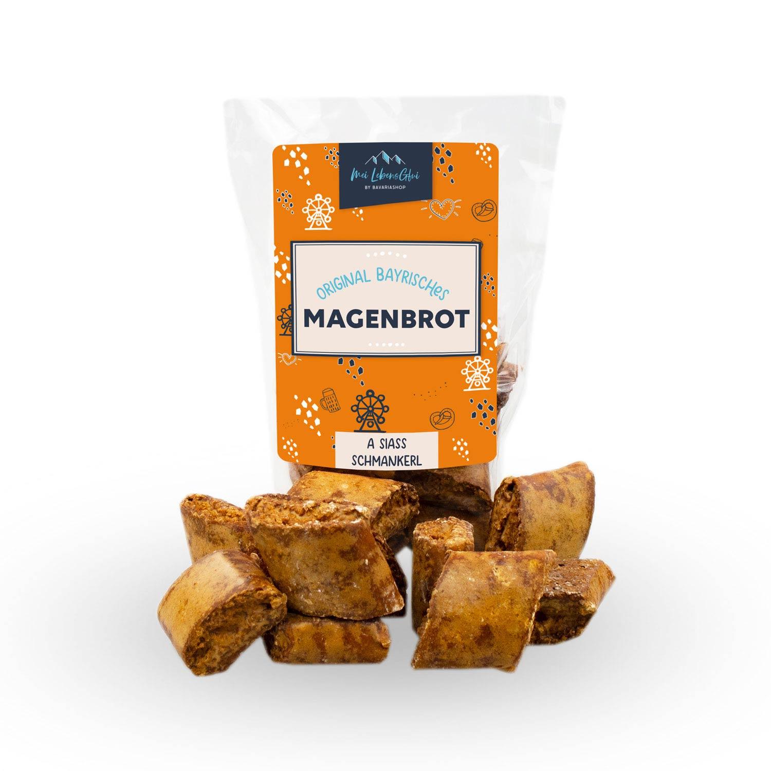 Original Bayerisches Magenbrot in transparenter Packung mit orangefarbenem Etikett und kleinen Magenbrotstückchen