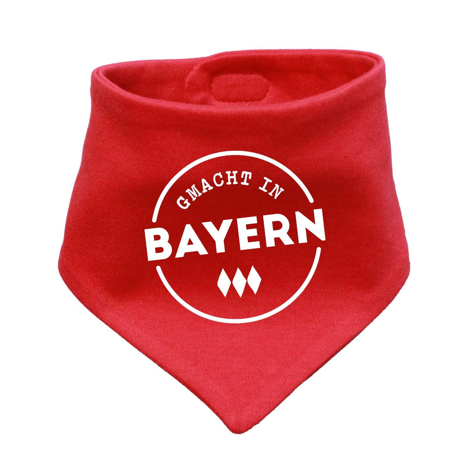 Rotes Babyhalstuch "Gmacht in Bayern" mit weißem Kreis-Schriftzug und drei stilisierten Rauten.