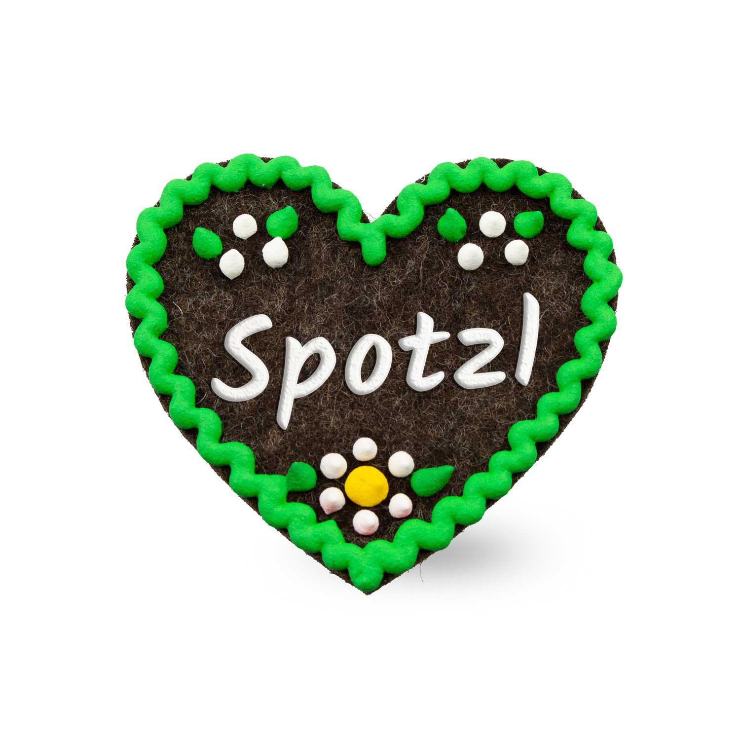Filzherz-Anstecker Spotzl in Braun mit grüner Bordüre, weißen Punkten und gelber Blüte, traditionelles Accessoire.