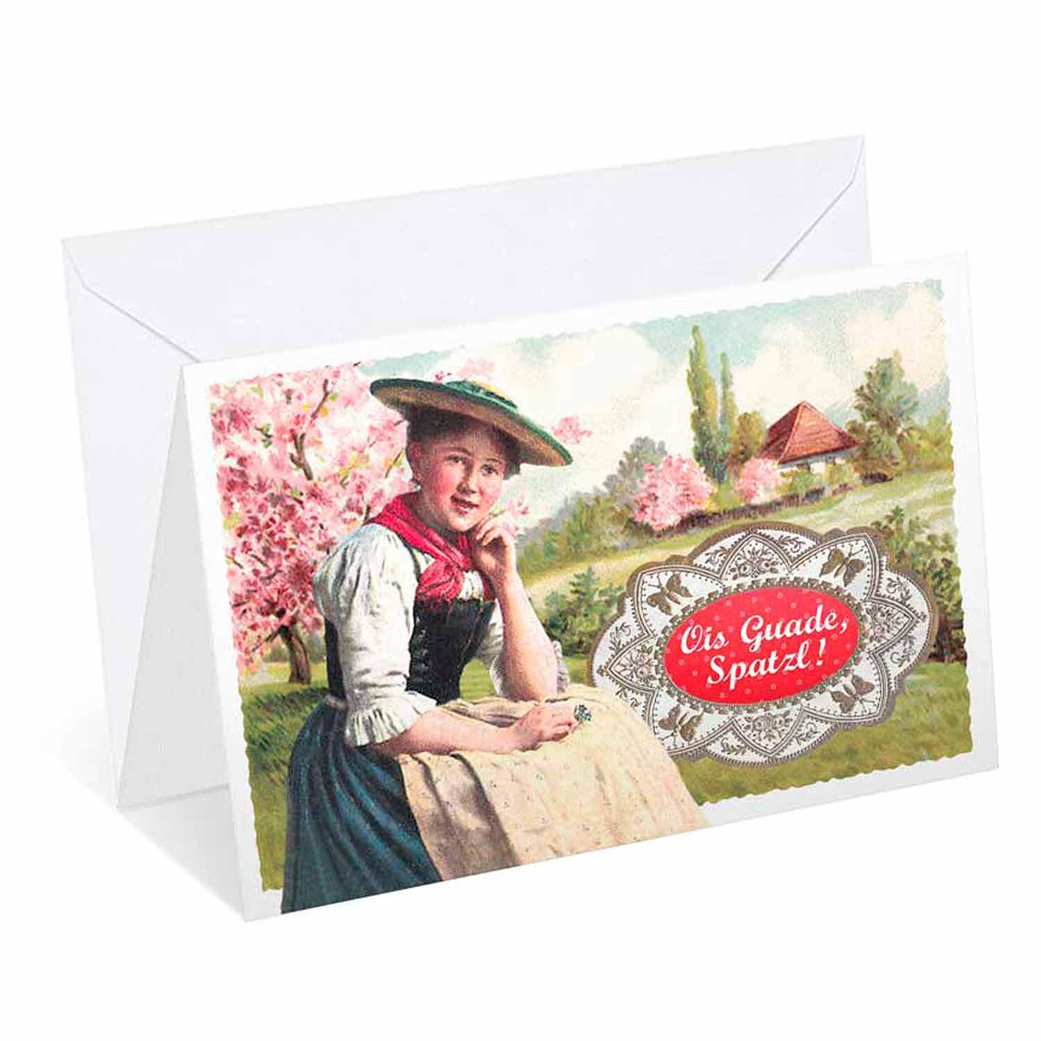 Traditionelle Grußkarte mit bayerischem Mädchen im Dirndl vor blühenden Bäumen, Aufschrift "Ois Guade, Spatzl!".