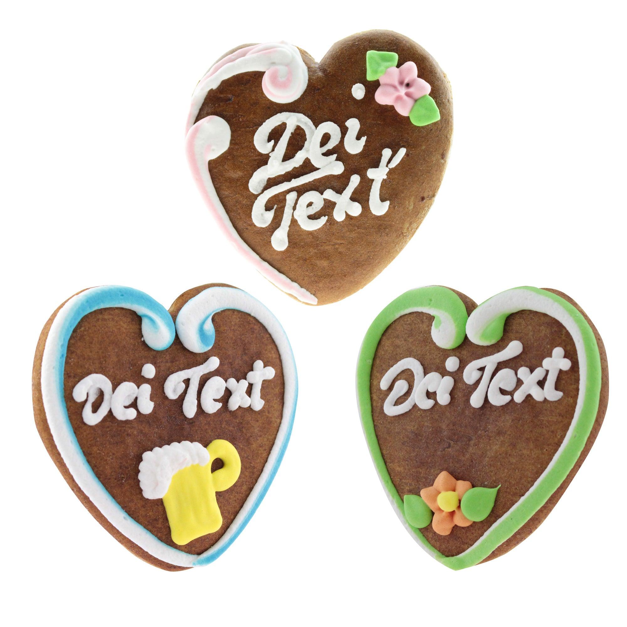 Set von drei personalisierbaren Lebkuchenherzen mit individueller Textgestaltung und Dekorationen wie Blümchen oder Maßkrug.