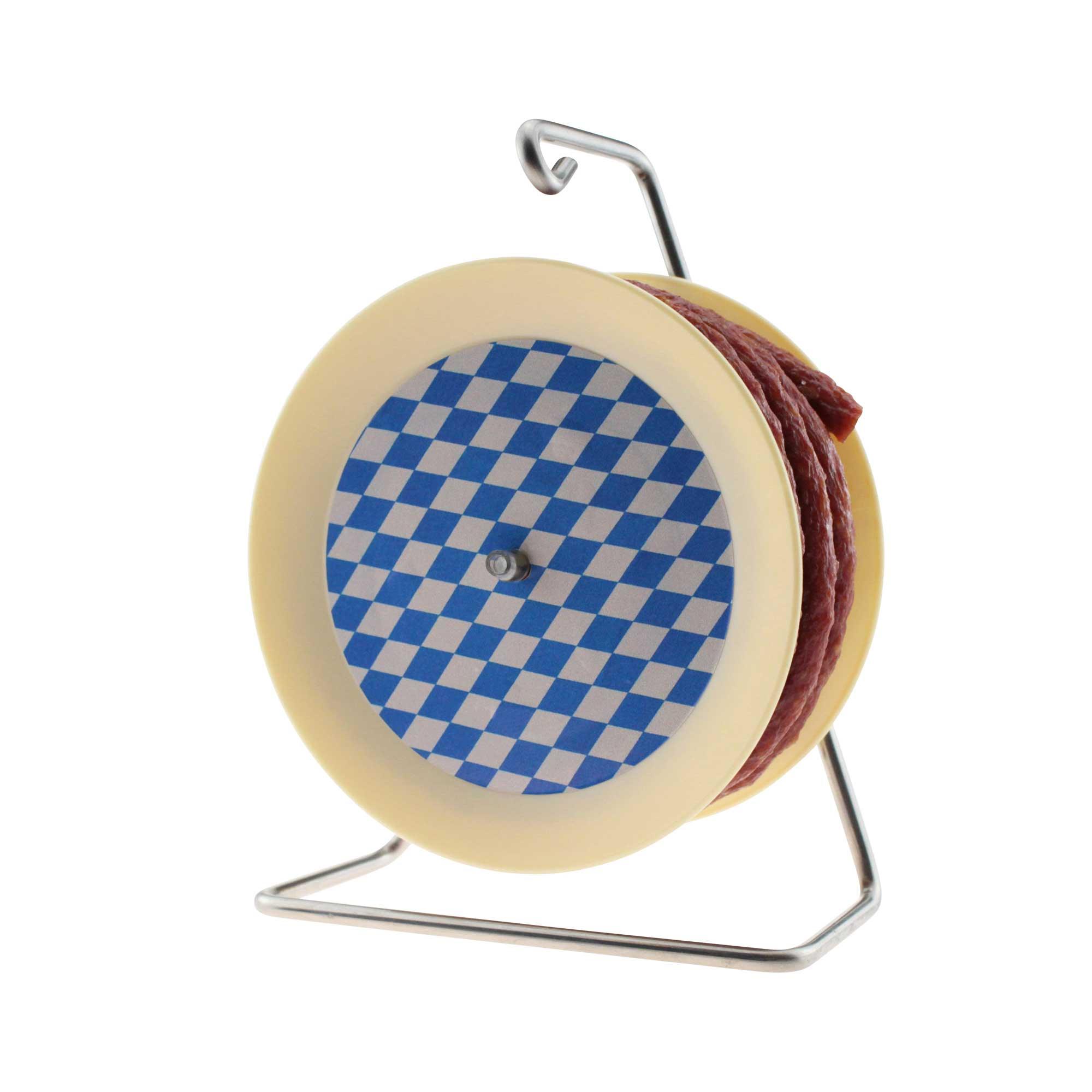 Küchenrollenhalter in beige mit blau-weißem Rautenmuster und roter Kordel auf einem Metallständer.