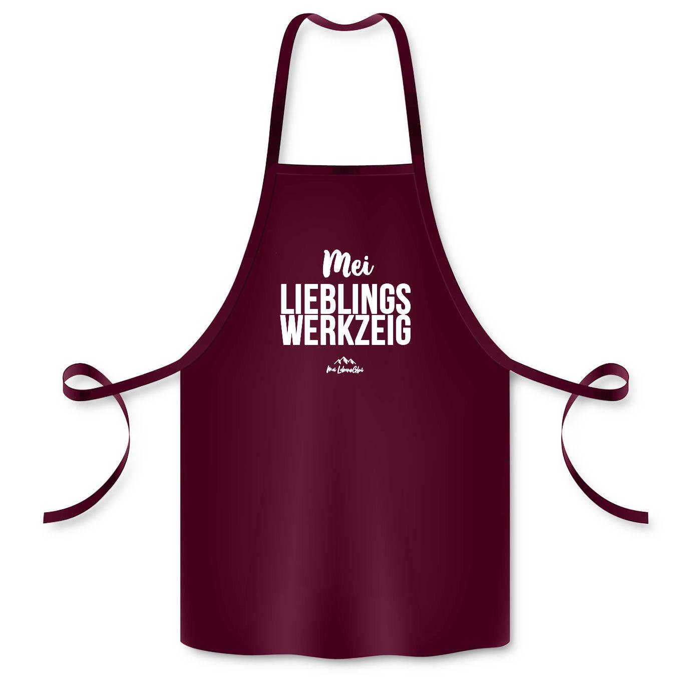 Bordeauxrote Schürze Mei Lieblingswerkzeig mit weißem Schriftzug und Kordeln zum Binden für Küche und Grill