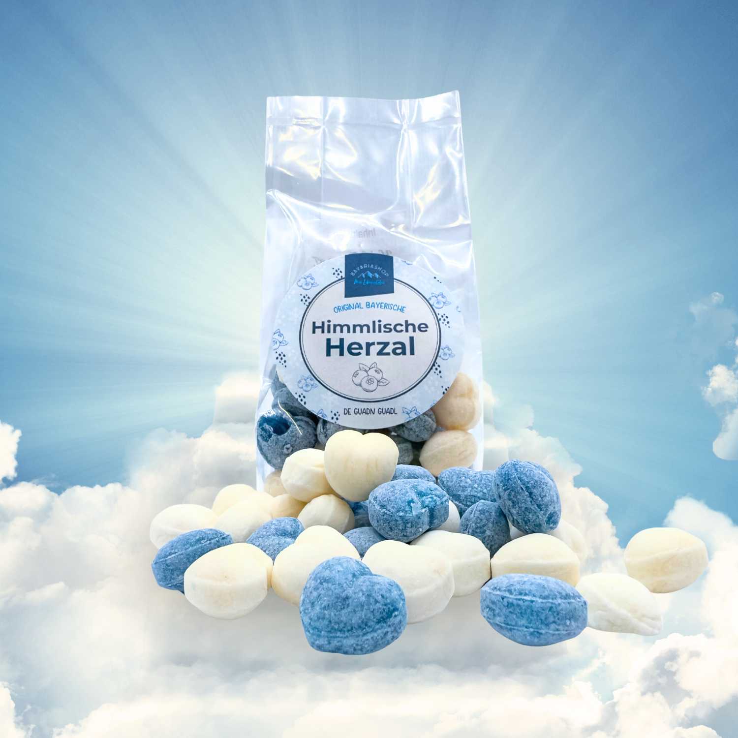 Himmlische Herzal - Guadl in Blau-Weiß-Tönen auf Wolken vor blauem Himmel.