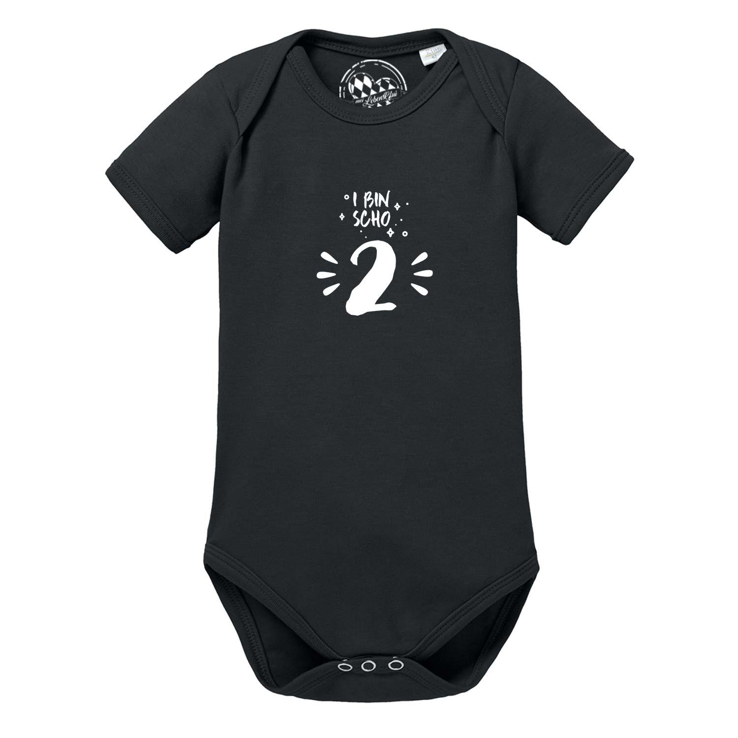 Schwarzer Baby Body "I bin scho 2!" mit weißem Aufdruck und passenden Druckknöpfen für Mädchen oder Jungen.