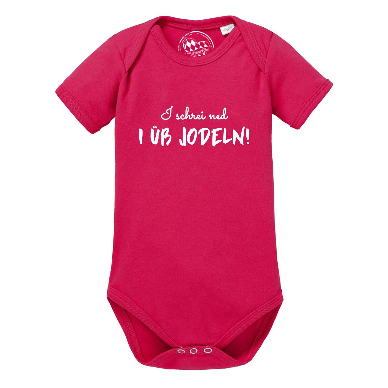 Baby Body I üb jodeln in kräftigem Pink mit weißem Spruch für lustige Babymode