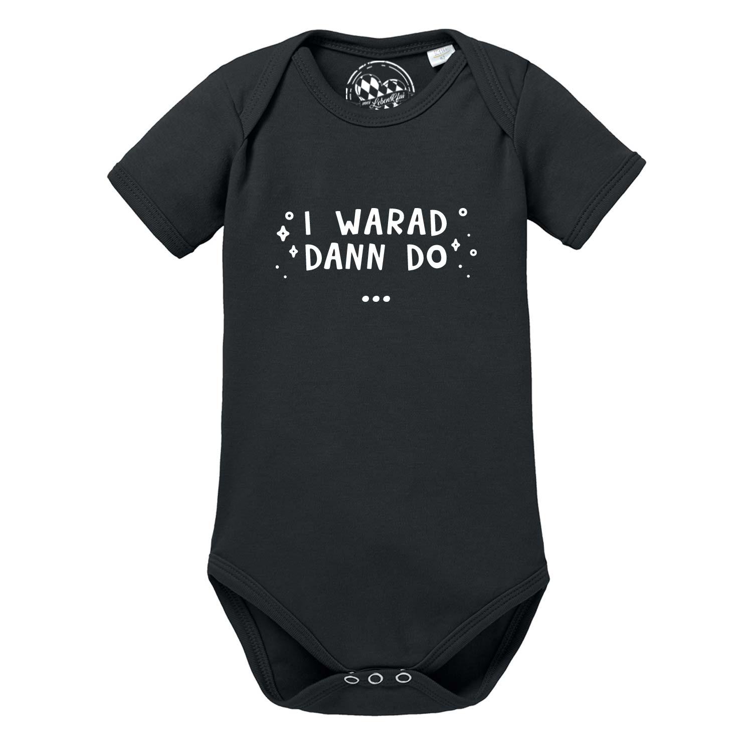 Schwarzer Baby Body "I warad dann do" mit weißem Spruch und kleinen Sternchen für Neugeborene.