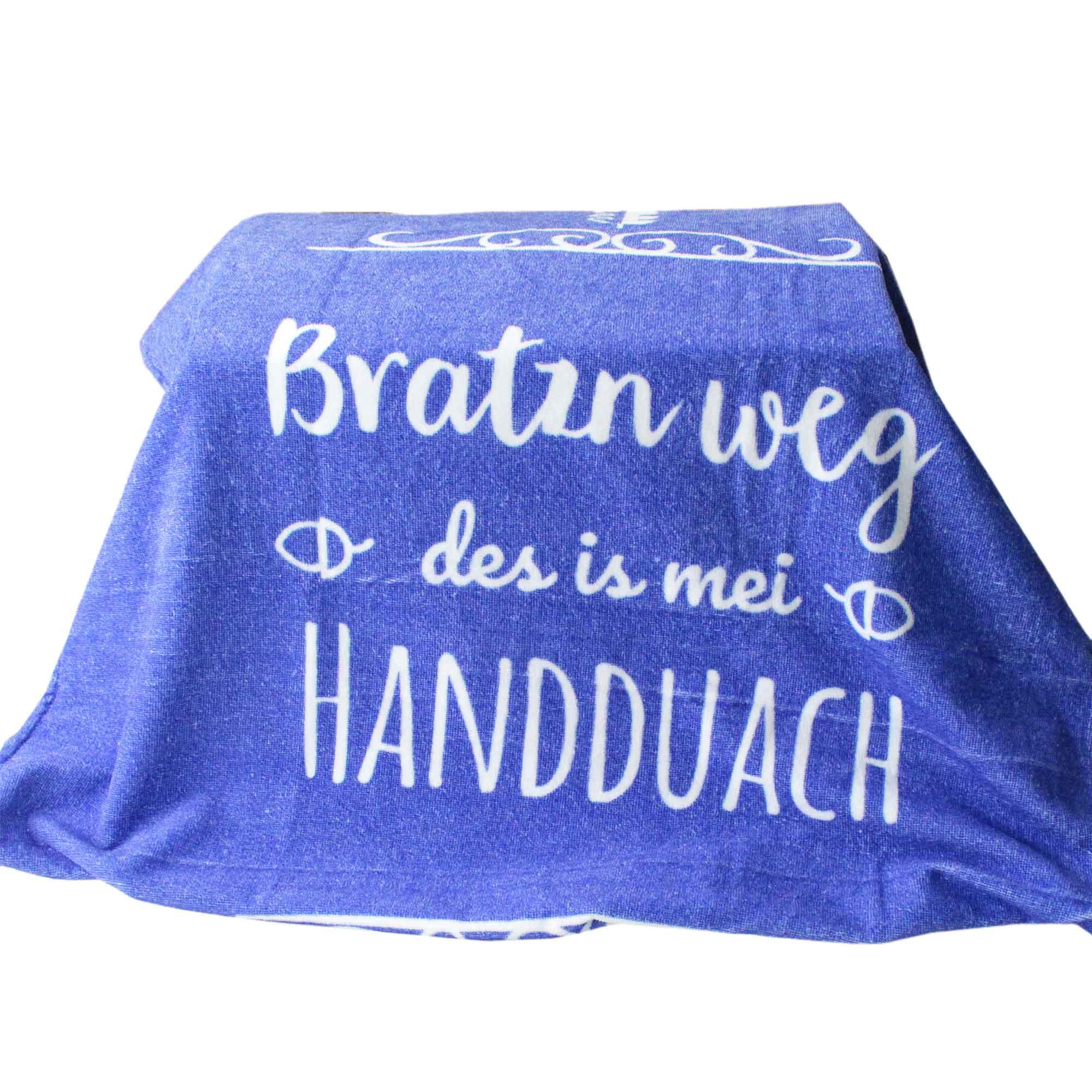 Blaues Badetuch mit weißem Schriftzug "Bratzn weg - des is mei HANDDUACH" für humorvolle Strandausflüge.