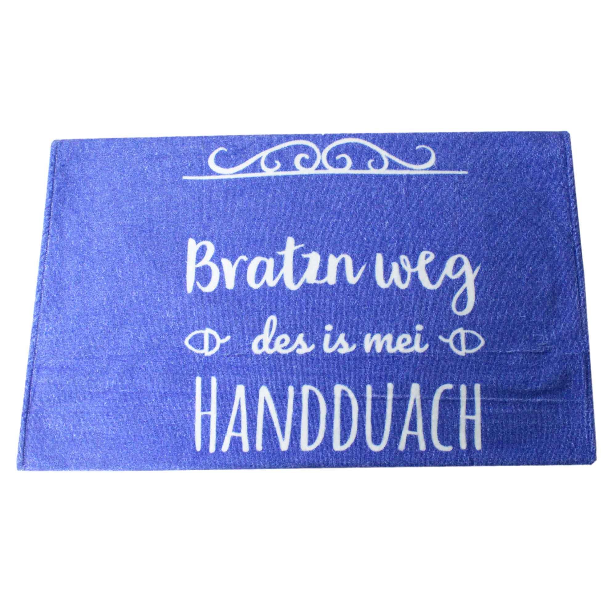 Blaues Handtuch mit weißer Aufschrift "Bratzn weg - des is mei HANDDUACH" und Zierornamenten.