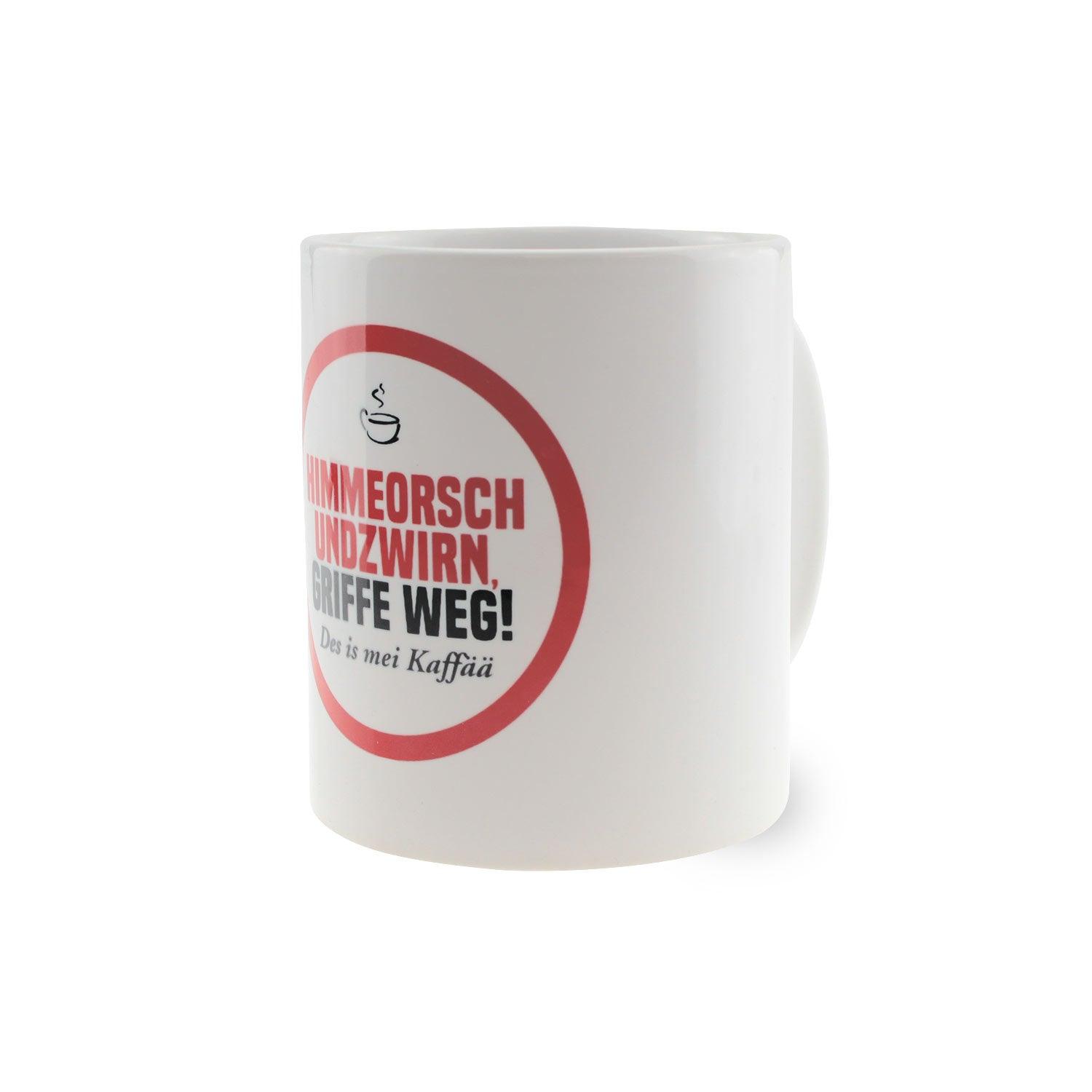 Weißes Kaffee-Haferl "Himmeorschundzwirn" mit rotem Aufdruck "GRIFFE WEG! Des is mei Kaffää", bayerischer Trinkbecher.