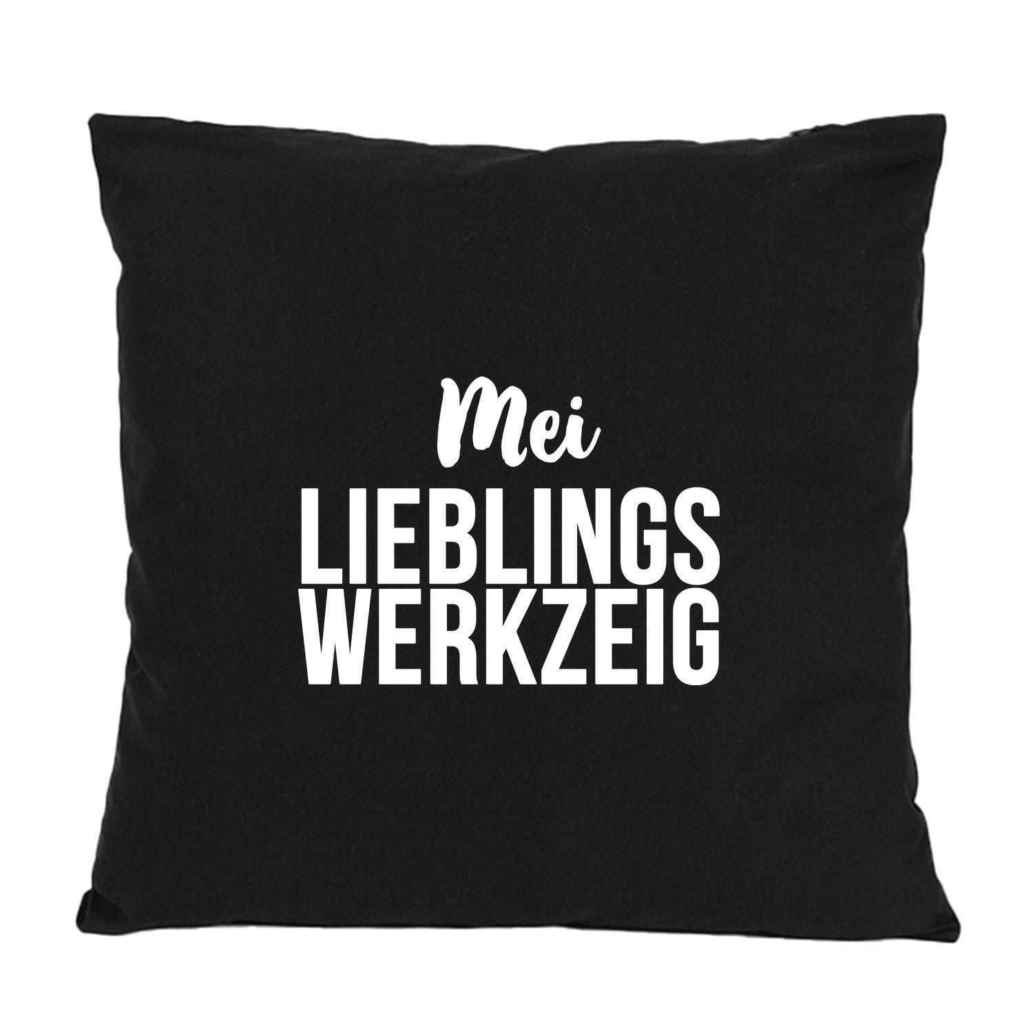 Schwarzes Kissen "Mei Lieblingswerkzeig" mit weißem Schriftzug, moderne Typografie, perfekt als Geschenk oder Deko.