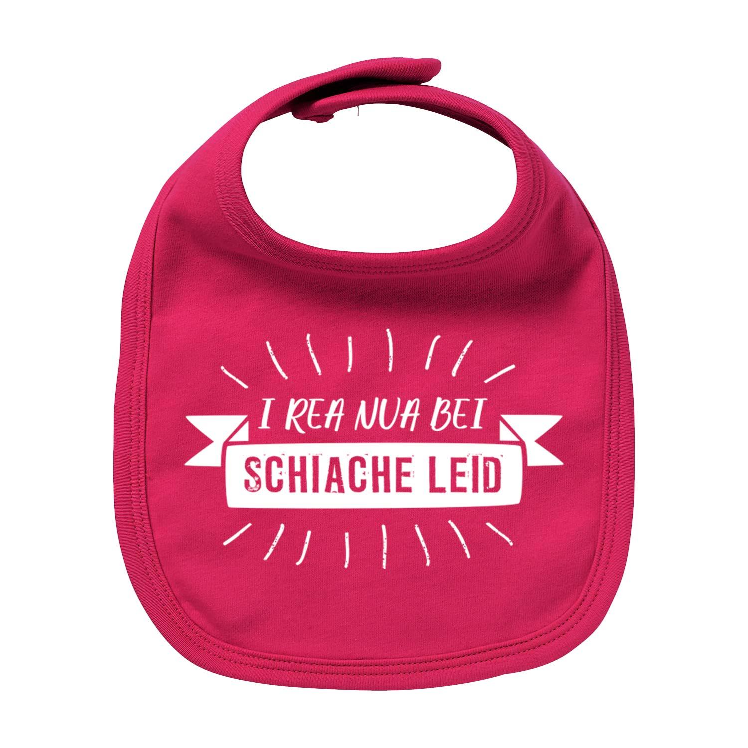 Pinkes Lätzchen "I rea nua..." mit weißem Spruch "I rea nua bei Schiache Leid", Klettverschluss.