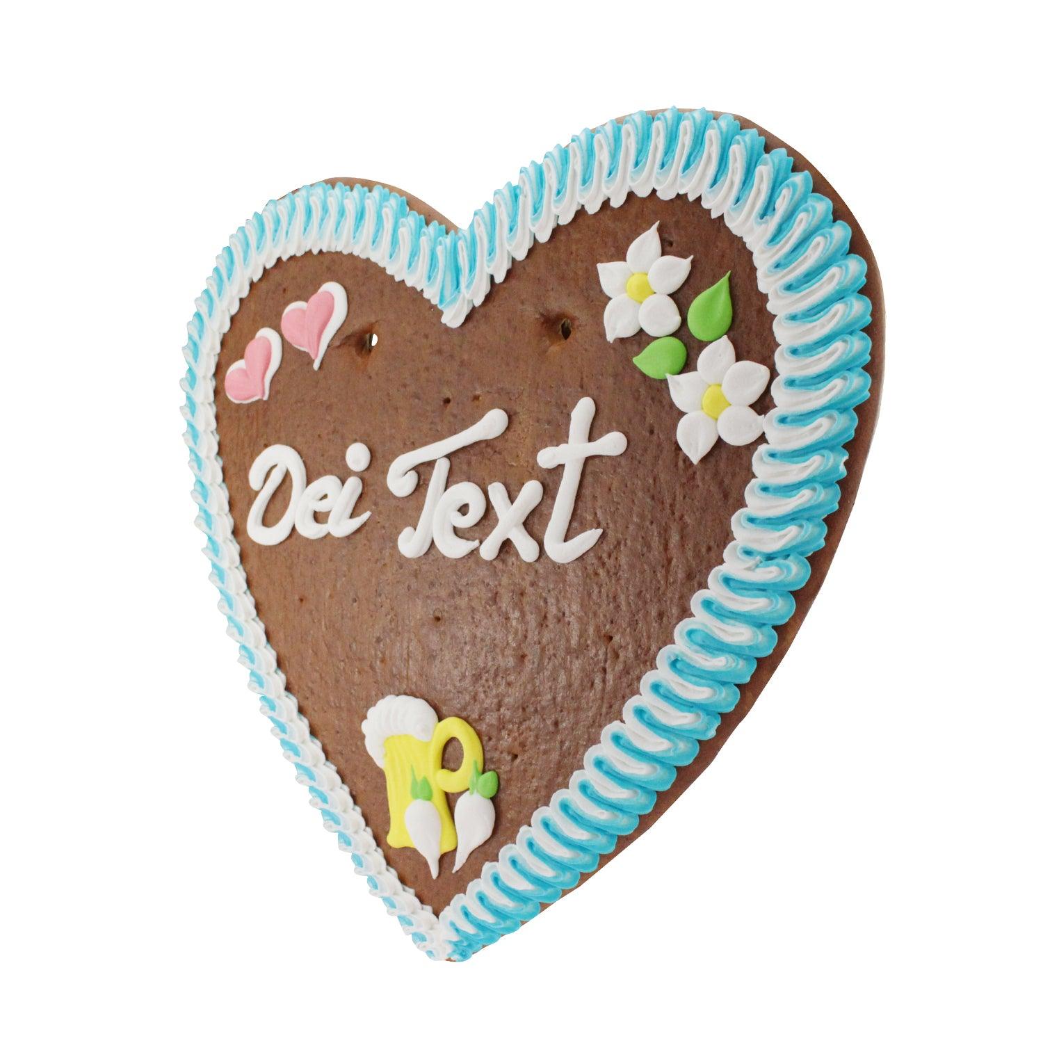 Braunes Lebkuchenherz mit blau-weißer Zuckergussverzierung, Bayern-Motiven und Aufschrift "Dei Text".