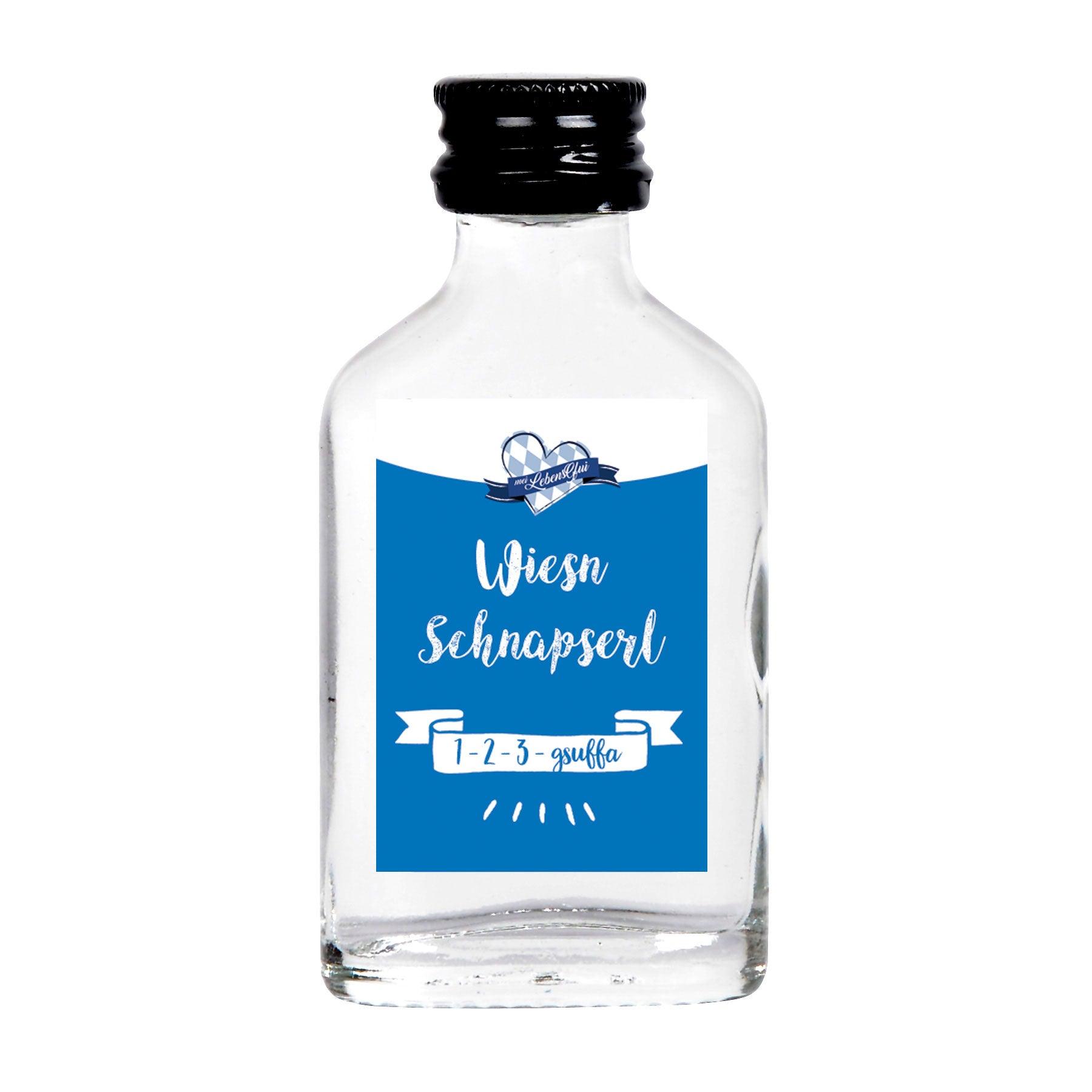 Oktoberfest-Box "Löwenbräu 2" Schnapsflasche mit blauem "Wiesn Schnapserl" Etikett und schwarzem Drehverschluss.